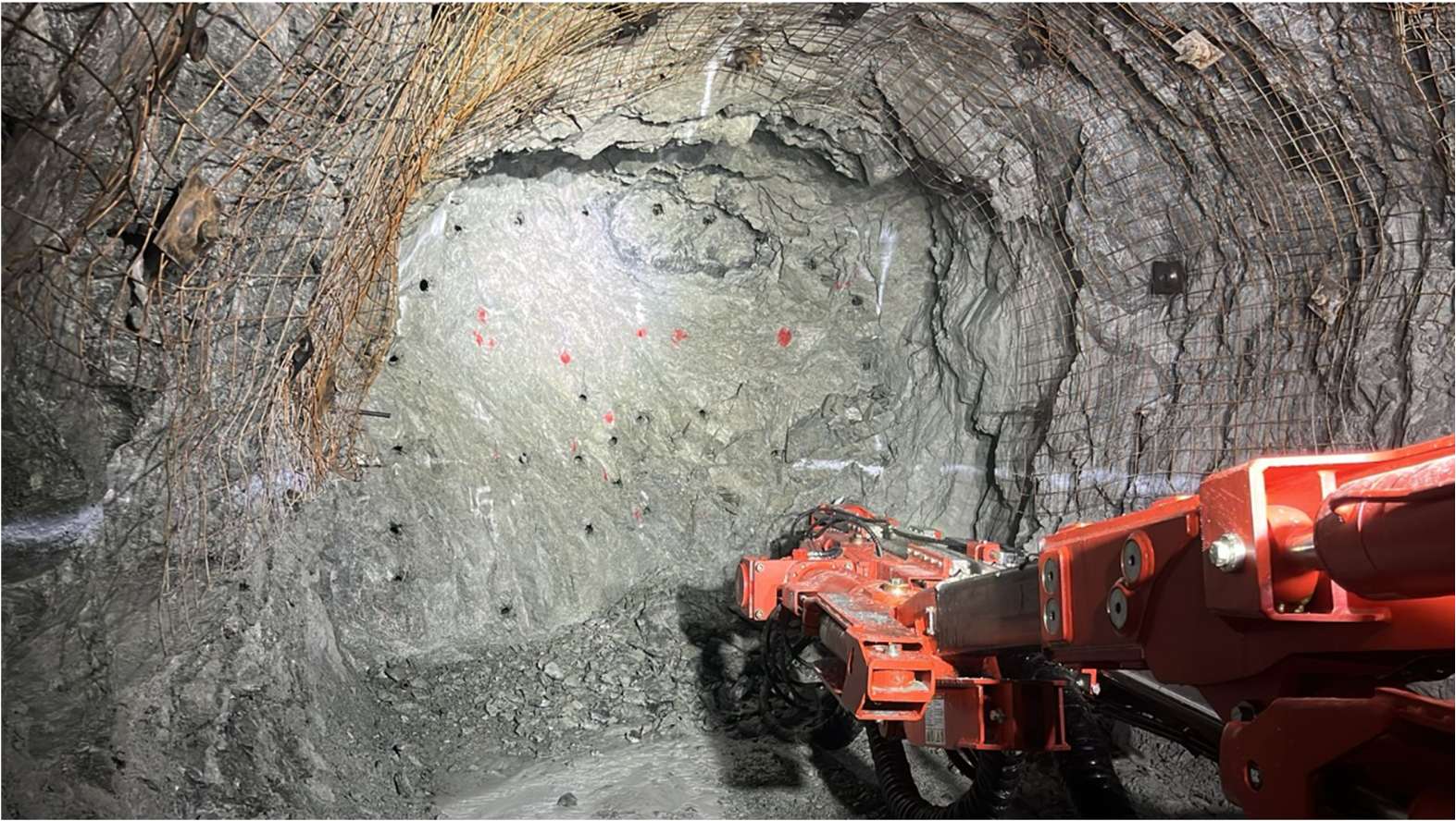 Jumbo drilling a face underground at San Ramón