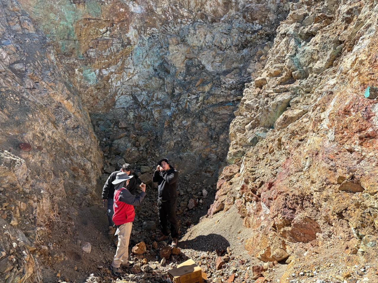Geologists inspecting the Q’Inti breccia outcrop