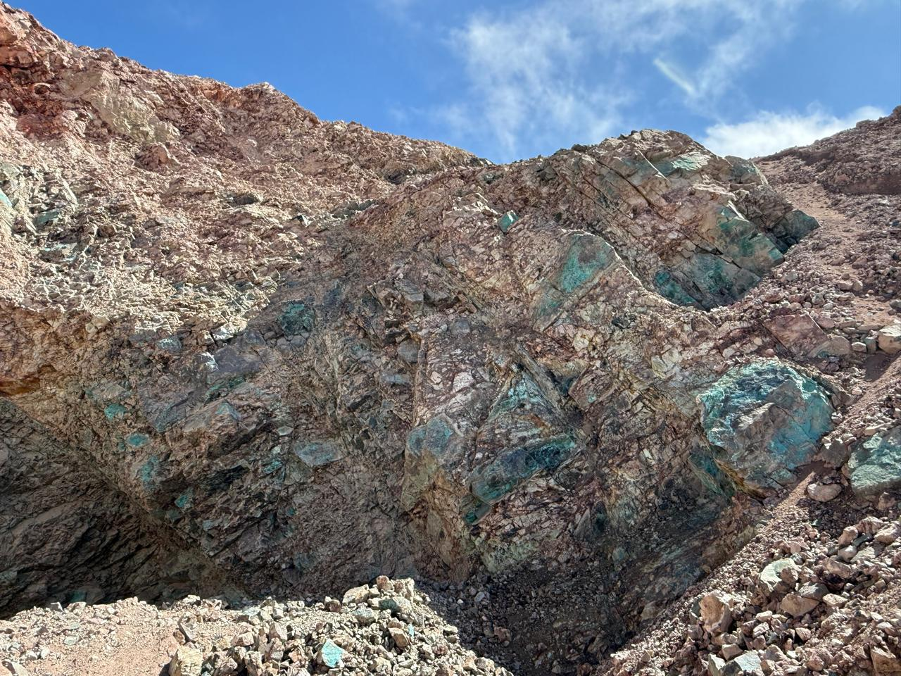 Copper-oxide mineralization exposed on a hillside at Q’Inti